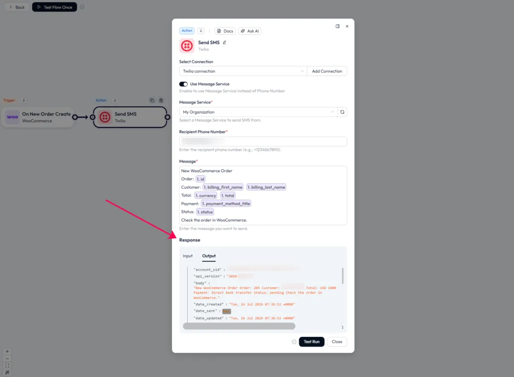 Bit Flows Twilio action configuration, mapping dynamic WooCommerce fields like order ID, customer name, total, and payment method into the SMS message body.